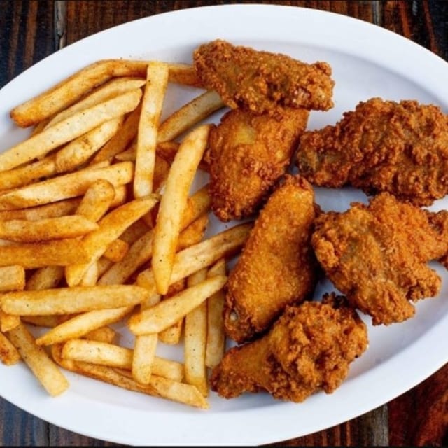 Six Pcs Chicken Wings with Fries.